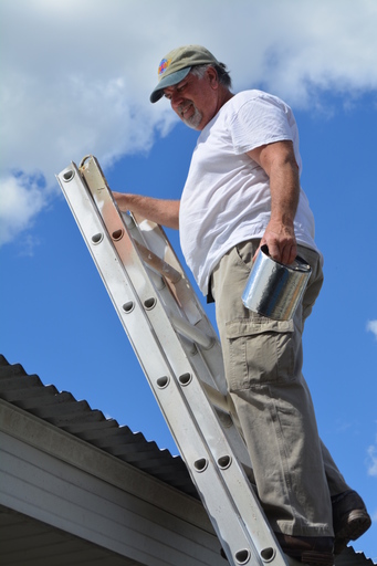 Fred Delaney working on a roof