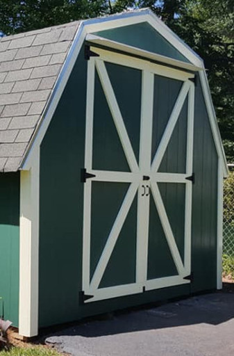 A freshly painted shed with new door and trim